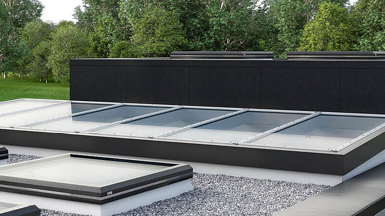 Glasdach Fire Resistance auf Flachdach mit umlaufendem Kiesbett und moderner Architektur.